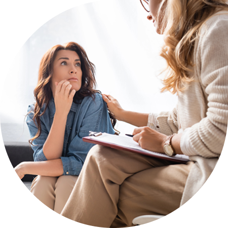 Stressed woman in a counselling session from a caring psychologist